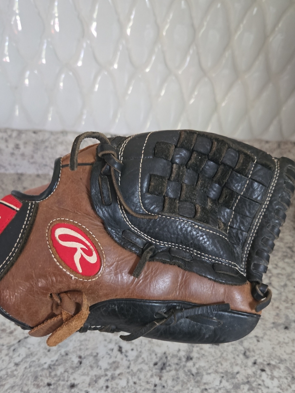 Rawlings Brown and Black Leather Baseball Glove with Embossed Logo